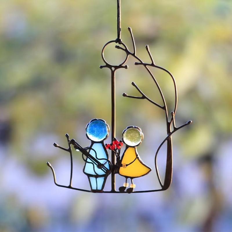Handmade glass art angel suncatcher, perfect decorative window hanging or home accent, with shimmering details.