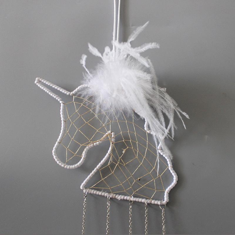 Dreamy unicorn dream catcher, handcrafted for a magical and serene kids' bedroom environment.