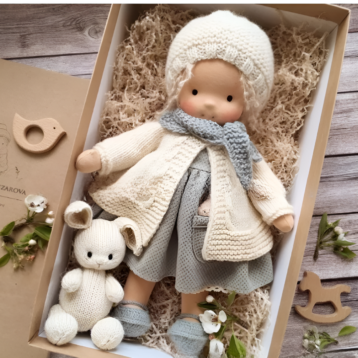 Eco-friendly soft Waldorf doll, a handmade natural toy for kids.