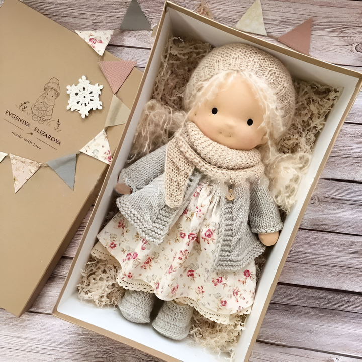 Soft handmade Waldorf doll, a cuddly natural toy for toddlers.