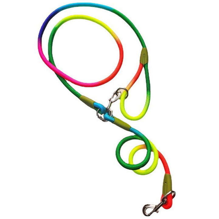 Woman hiking with her dog using a green hands-free nylon dog leash, demonstrating freedom of movement.