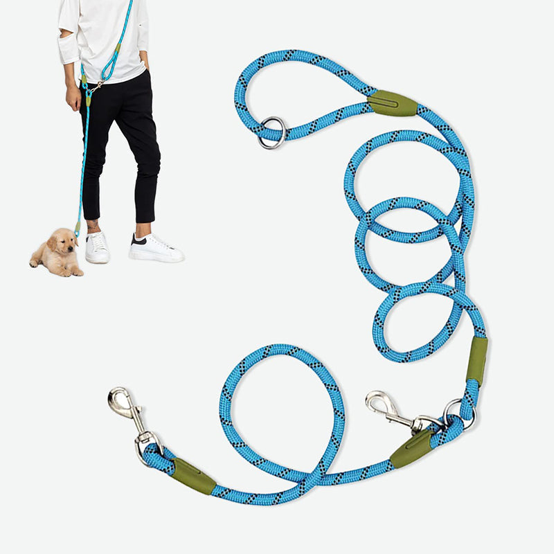 A golden retriever comfortably walking alongside its owner, attached to a red hands-free dog leash.