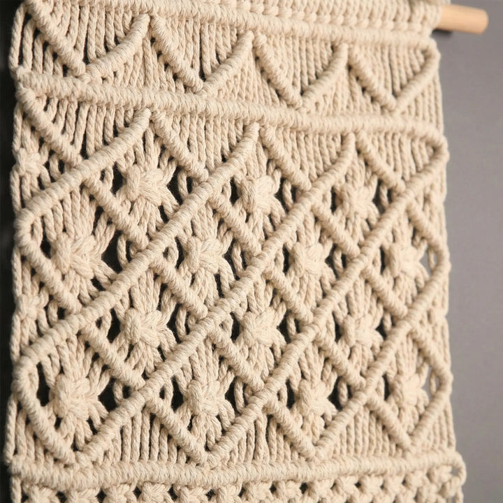 Bohemian handwoven wall planter for indoor plants. Stylish macrame plant display & decorative storage.