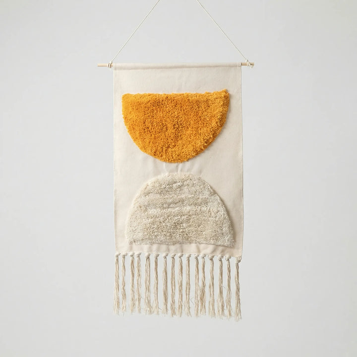 Bohemian handwoven geometric textile wall art tapestry with modern wave design & decorative fringe.