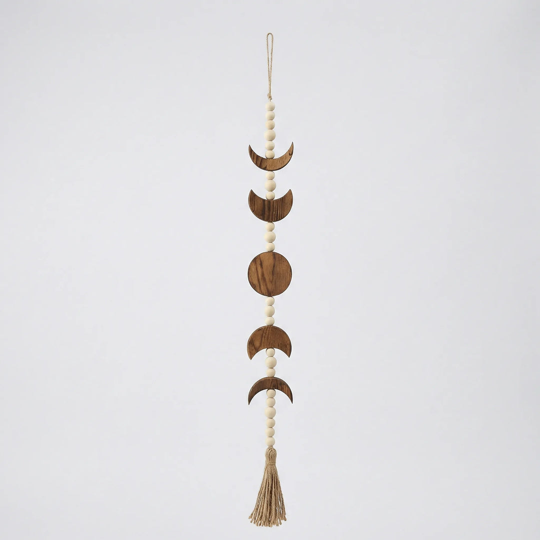 Textured handwoven wall hanging featuring a serene moon motif. Perfect neutral bohemian woven art for home decor.