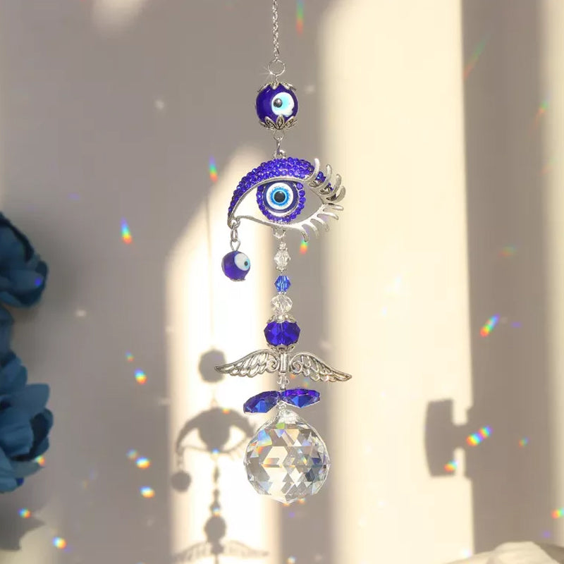 Vibrant blue evil eye suncatcher, creates rainbows indoors