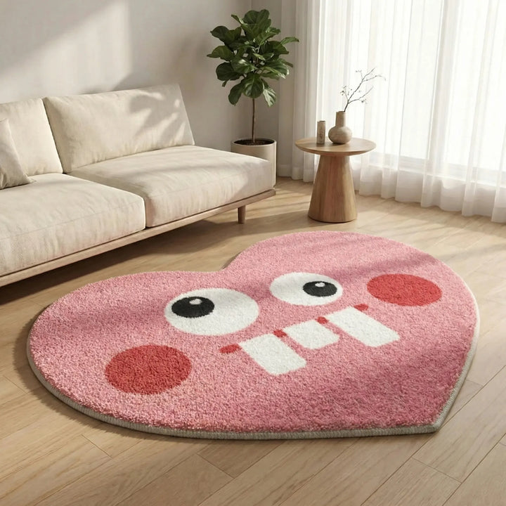 Versatile heart-shaped accent rug for living rooms & bedrooms. Features easy-care and slip-resistant backing.