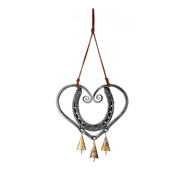 Artistic heart-shaped metal wind chime, creating soothing sounds and romantic garden ambiance.