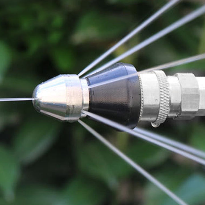 Close-up of a sewer jetting nozzle showing multiple high-pressure spray jets