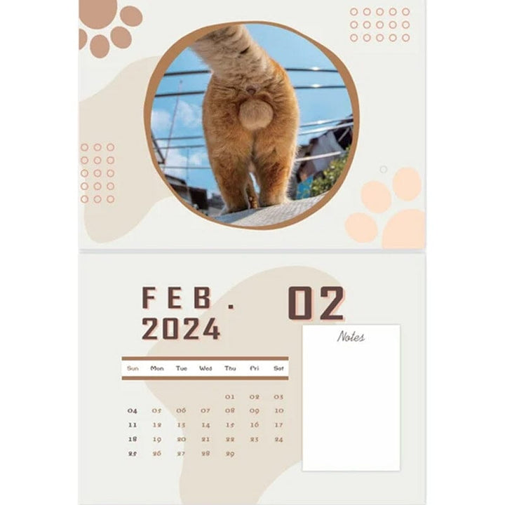 Humorous cat-themed wall calendar showcasing artistic feline expressions, 12-month format
