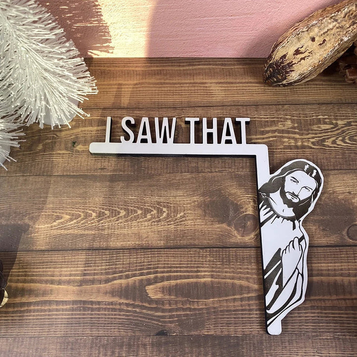 Detailed view of a funny 'I Saw That' door hanger, showcasing quality wood decor material