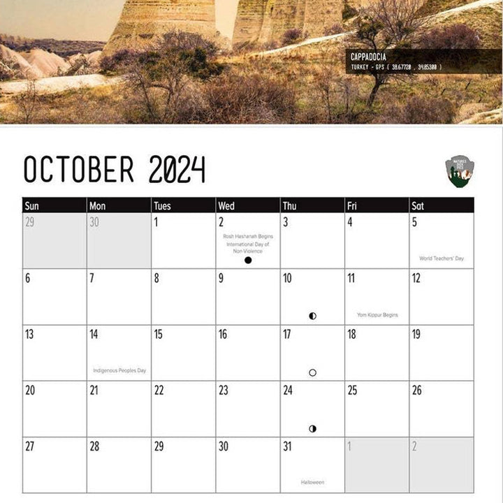 Open Humorous Nature Wall Calendar 2024 on a desk, showcasing a funny nature picture, office decor