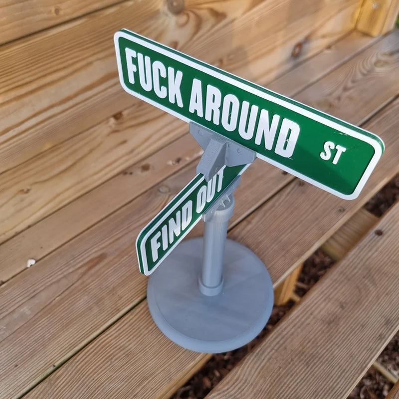 Desk decor featuring a funny street sign, a great gift idea for colleagues
