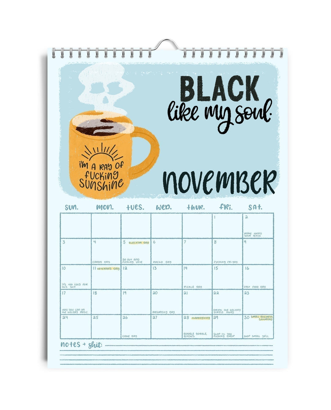 Flat lay of the 2025 Humorous Sweary Calendar, surrounded by office supplies, funny planner