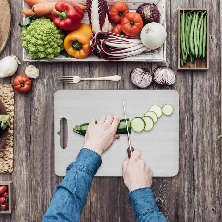 Hygienic titanium cutting board, durable for food prep. Dishwasher safe, modern kitchen tool.