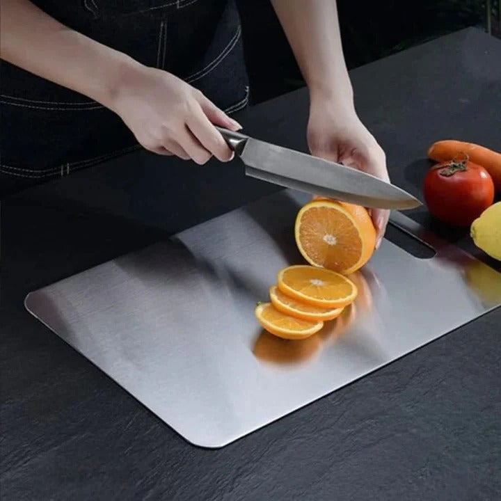 Hygienic titanium cutting board. Durable, dishwasher safe, space-saving for efficient food prep.