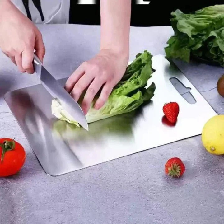 Sleek, hygienic titanium cutting board for modern kitchen food prep. Durable, space-saving kitchen tool.