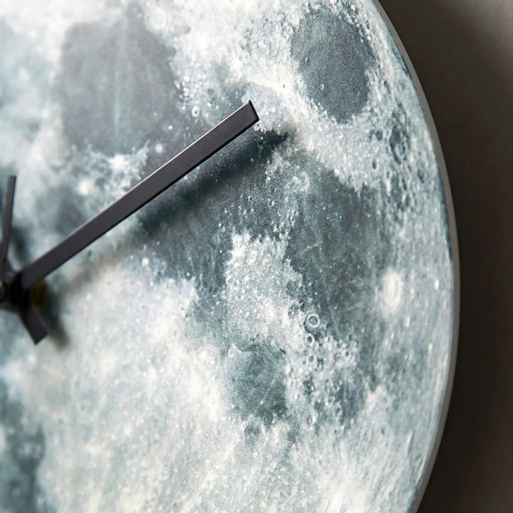 Silent decorative moon wall clock featuring ambient lighting and a gentle glow, ideal for bedroom or living room.