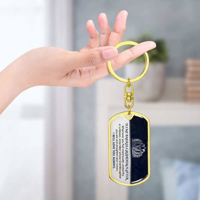 Close-up of inspirational family keepsake keychain, polished metal, engraved quote visible