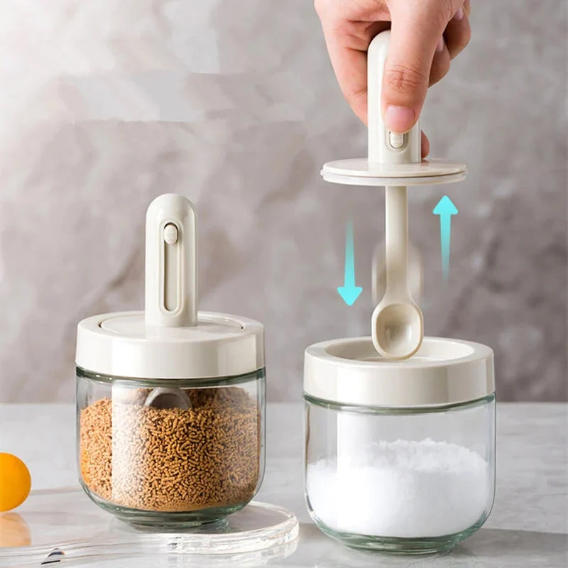 Clear glass spice jar with integrated spoon, perfect for kitchen seasoning organization