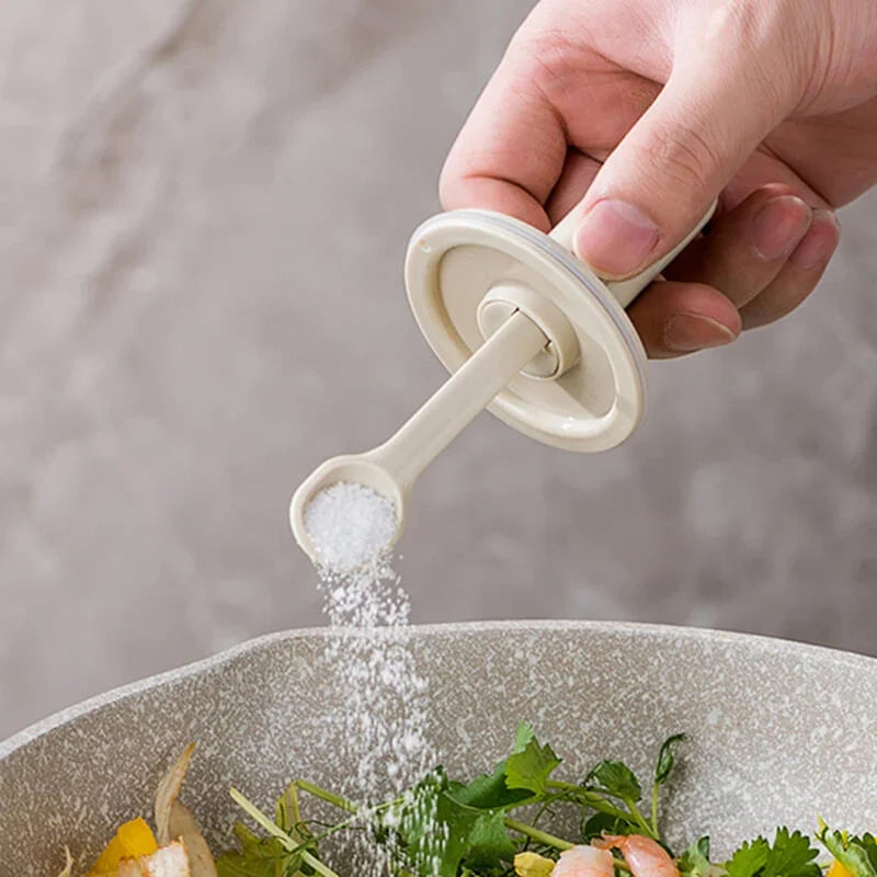 Seasoning container with spoon, glass design, keeps spices fresh and accessible in kitchen