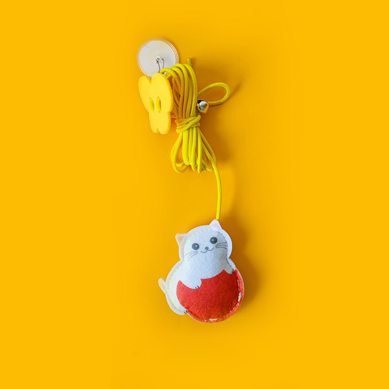 Interactive cat toy in motion, demonstrating its elastic bounce for engaging and enriching feline playtime