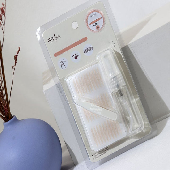 Arrangement of invisible eyelid tapes, a cosmetic aid for enhancing eye shape and achieving eye lift.