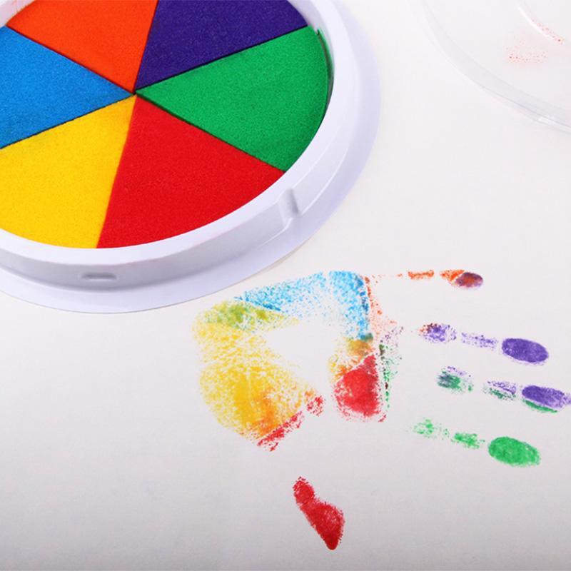 Young child's colorful finger painting artwork created using the Creative Art Kit supplies
