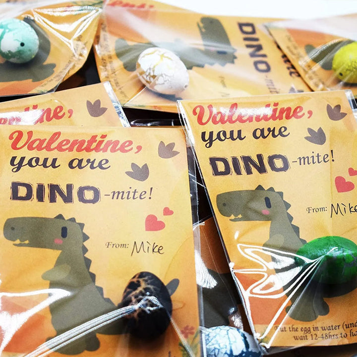 Tabletop display of 24 dinosaur hatching eggs for a kids' birthday party activity