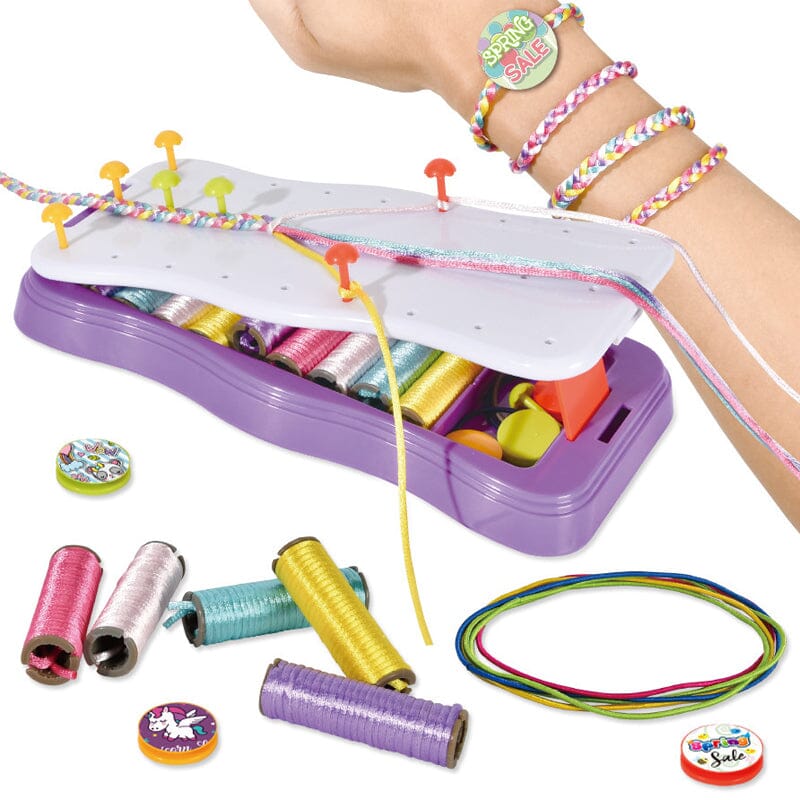 Child proudly showing off a handmade friendship bracelet from the DIY creative toy kit