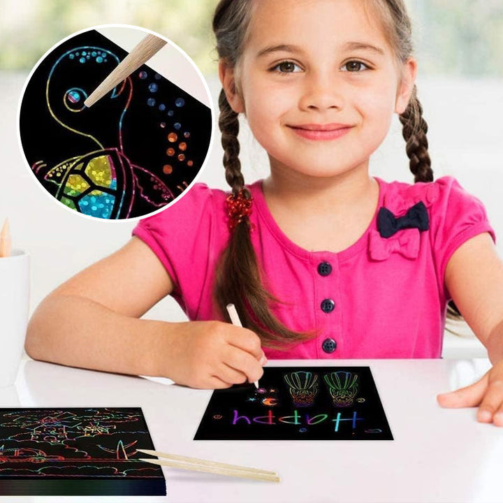 Multiple art sheets from the Kids DIY Rainbow Magic Scratch Art Set, ideal for holiday activity