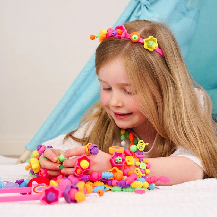 Packaging for Kids' DIY Snap Pop Beads Jewelry Making Kit, highlighting 'Girls Gift' and 'Creative Play' keywords