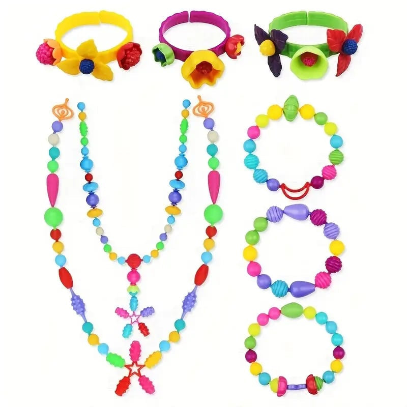 Close-up of different pop bead connectors and accessories included in a comprehensive DIY jewelry making kit