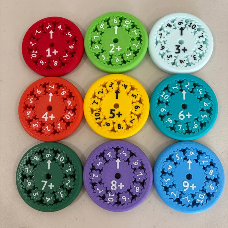 Child's hand holding a blue Math Fidget Spinner, focusing on learning addition