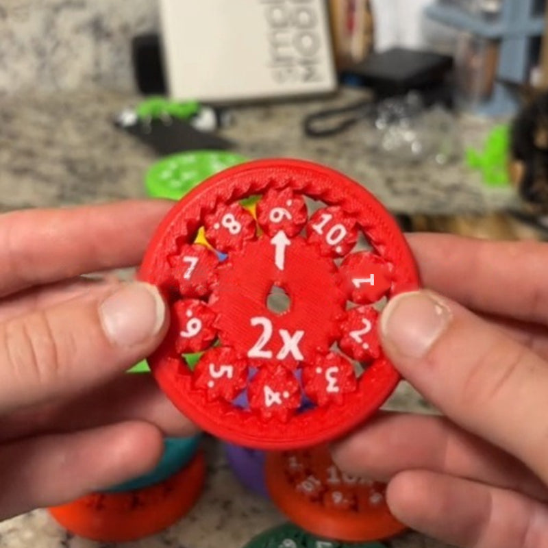 Vibrant green Math Fidget Spinner, demonstrating division problems for kids