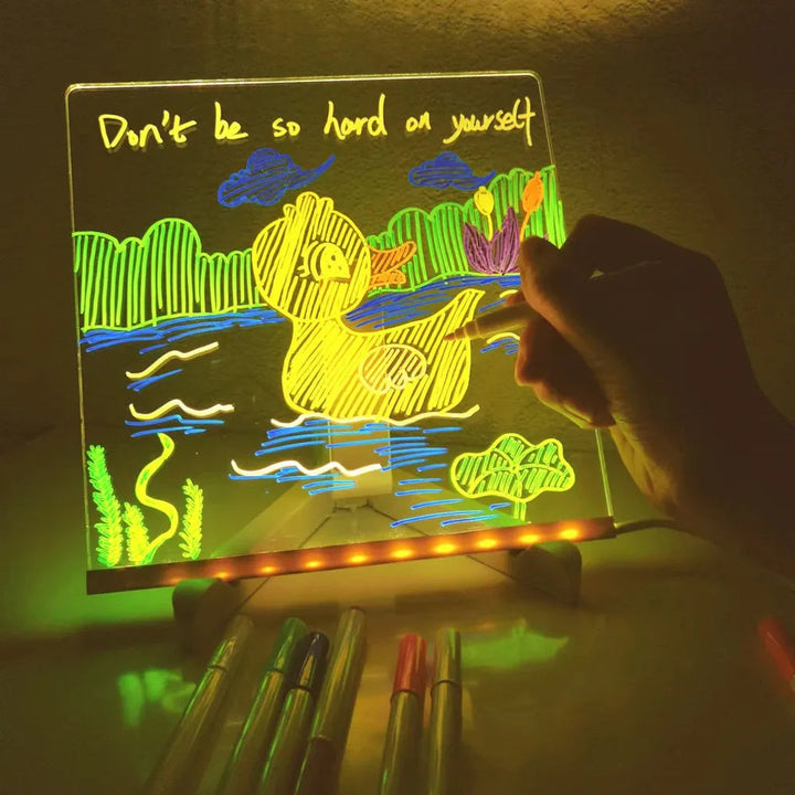 Kids' LED Drawing Board with illuminated screen, perfect for young artists to create glowing art. Educational & portable.
