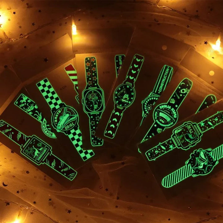 Kids luminous cartoon watch temporary tattoos glowing on a child's arm, fun party favor.