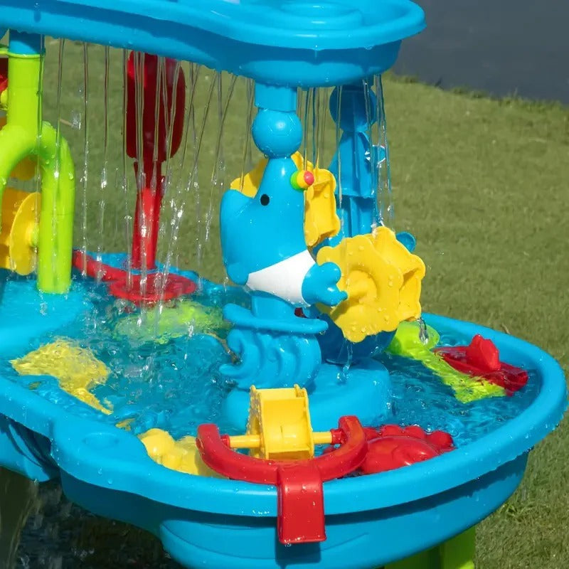 Children playing happily with the all-in-one outdoor sand & water play table, fostering sensory & backyard fun.