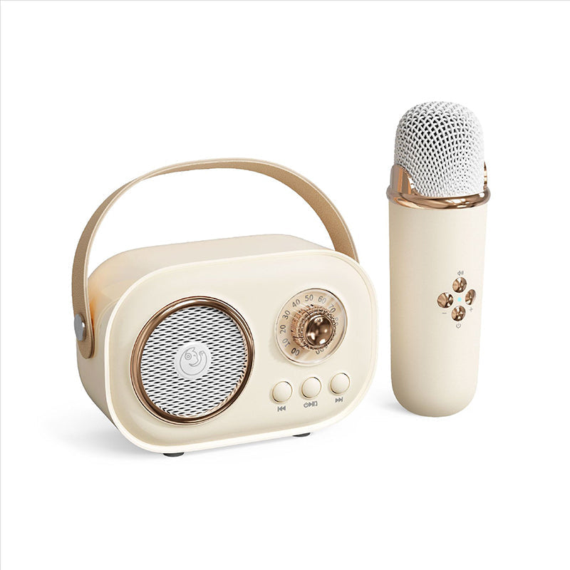 Unboxing a new kids' portable karaoke speaker with wireless microphone, revealing all accessories.