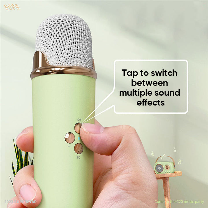Front view of a blue kids' karaoke speaker with mesh grille, control panel, and a wireless mic.
