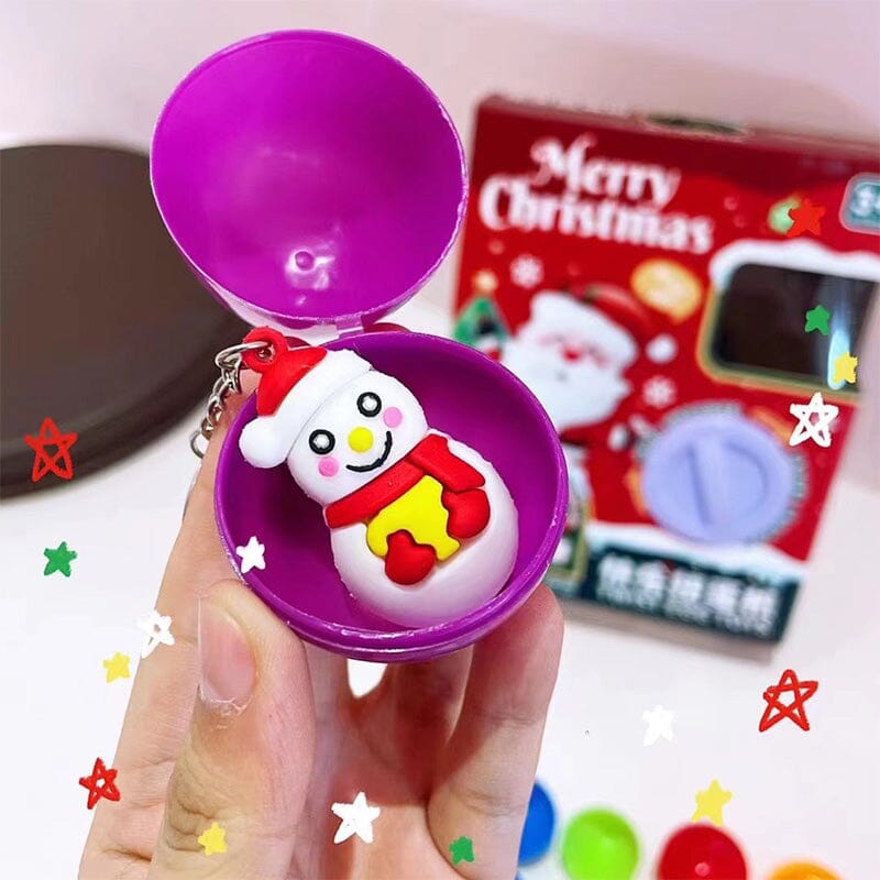 Family enjoying interactive playtime with a mini claw machine, a great holiday toy for children