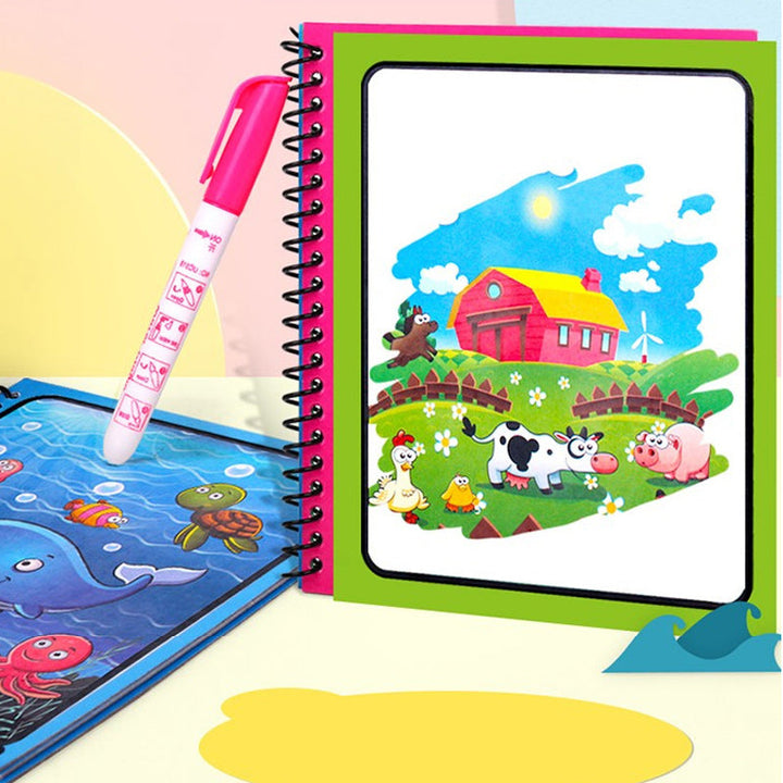 Girl smiling while playing with her new magic water coloring book, holding the refillable pen