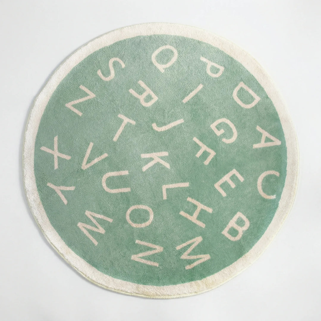 Educational alphabet round rug for kids' playrooms. Soft, colorful mat with letters for learning fun.