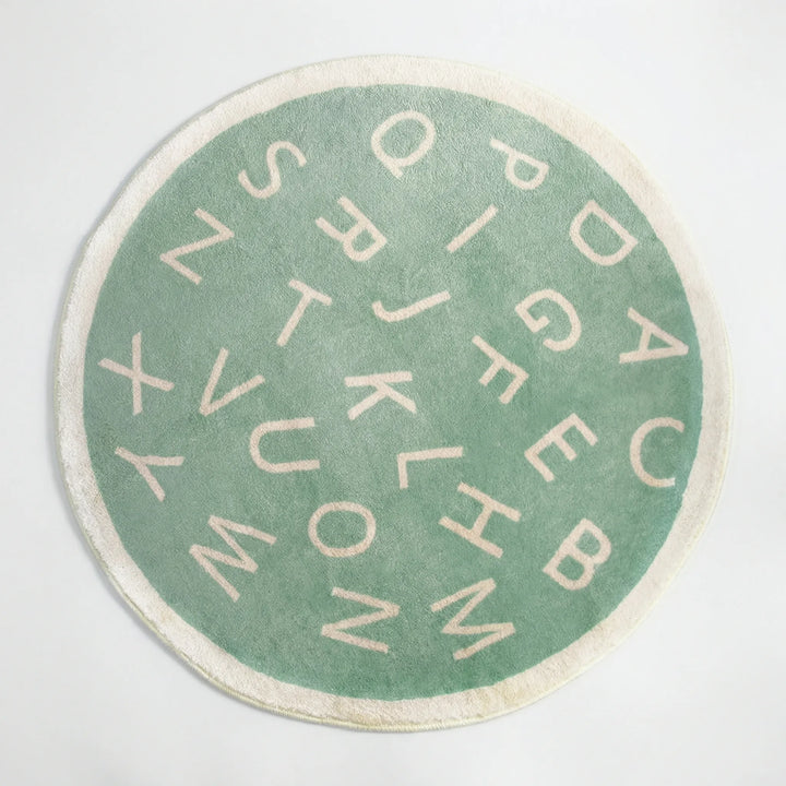 Educational alphabet round rug for kids' playrooms. Soft, colorful mat with letters for learning fun.