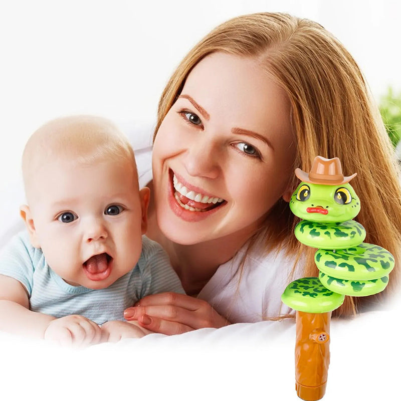 Child's hand holding a plastic swinging snake whistle, ready for playful action & entertainment