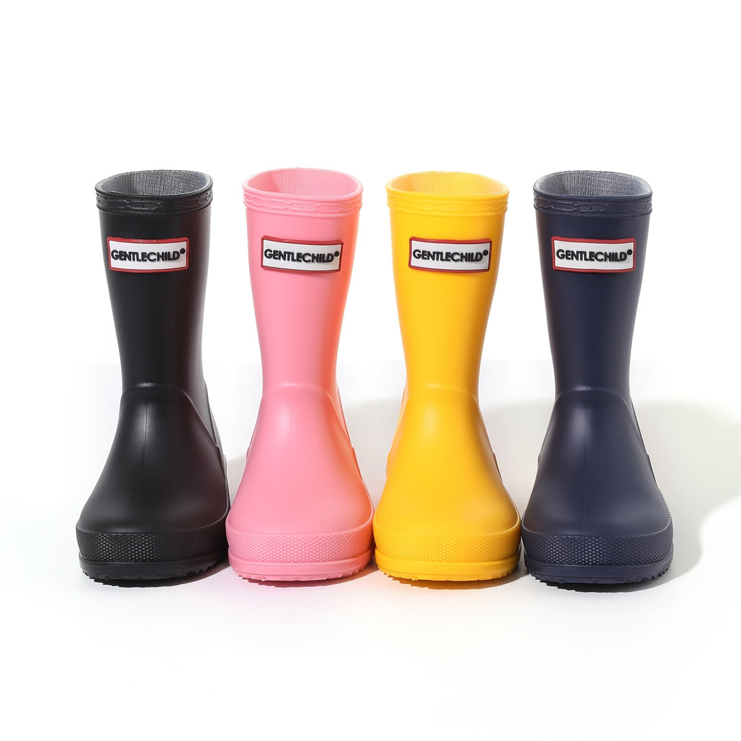 Child's foot in a waterproof non-slip rain boot, ready for outdoor puddle adventures.