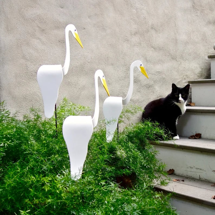 Metal flamingo yard art, elegant kinetic wind spinner, adds a touch of whimsy to any garden
