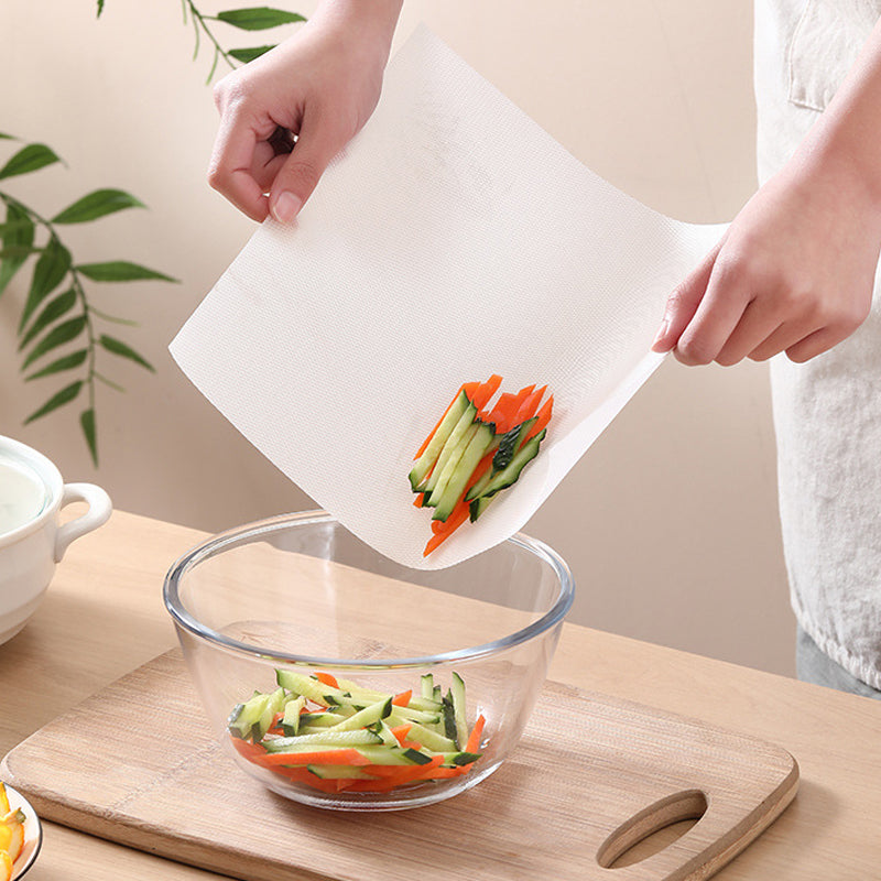 Kitchen scene: vegetables being chopped on a fresh sheet of Disposable Cutting Board Mat Roll