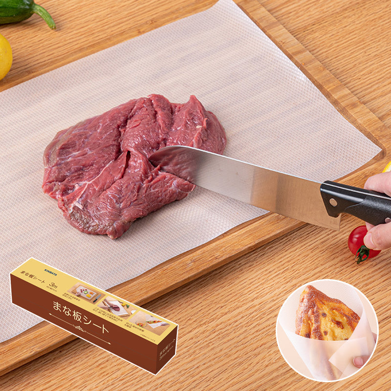 White disposable cutting board mat roll on a kitchen counter, ideal for meat & veggies