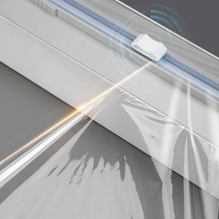 Sleek kitchen accessory: a wrap dispenser designed for easy and efficient cutting of various kitchen wraps.